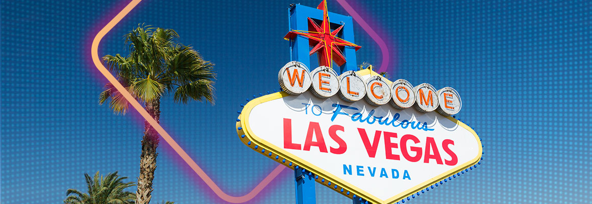 iconic las vegas sign against blue summer sky